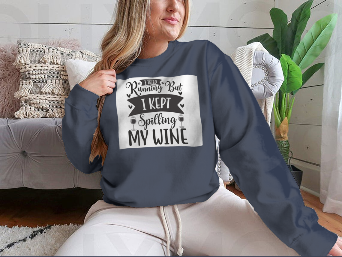 A cozy sweatshirt featuring the humorous phrase 'I Tried Running But I Kept Spilling My Wine', perfect for wine lovers.